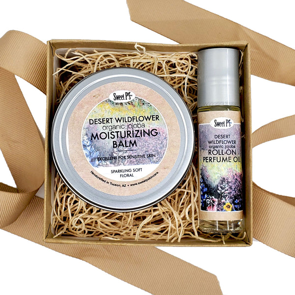 organic skincare gift set. Moisturizing balm for dry skin, in a sparkling soft floral scent and a roll on, jojoba perfume oil. 