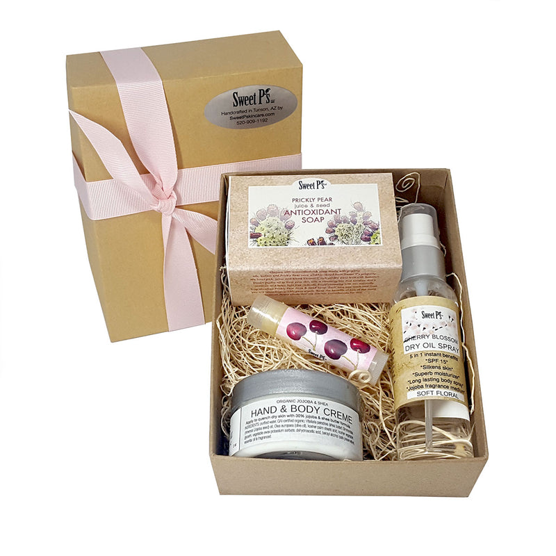 organic skincare gift set comes with prickly pear soap, cherry blossom dry oil spray and lip balm, and fragrance free hand and body creme