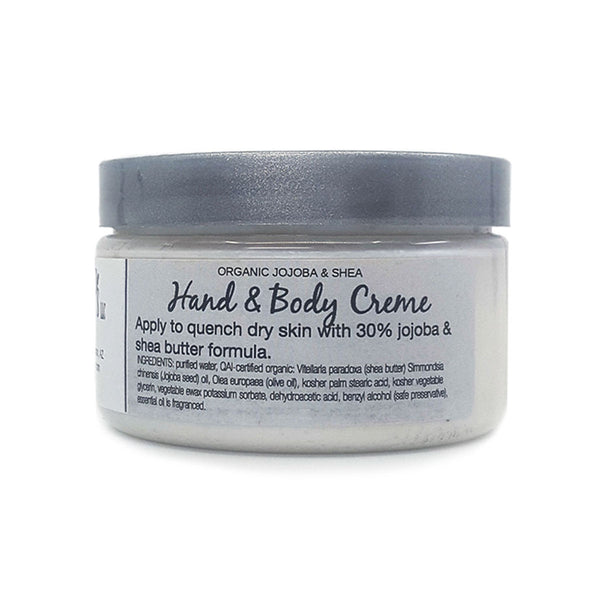 Fragrance free hand and body cream instantly moisturizes dry skin. Made with organic jojoba oil and shea butter.